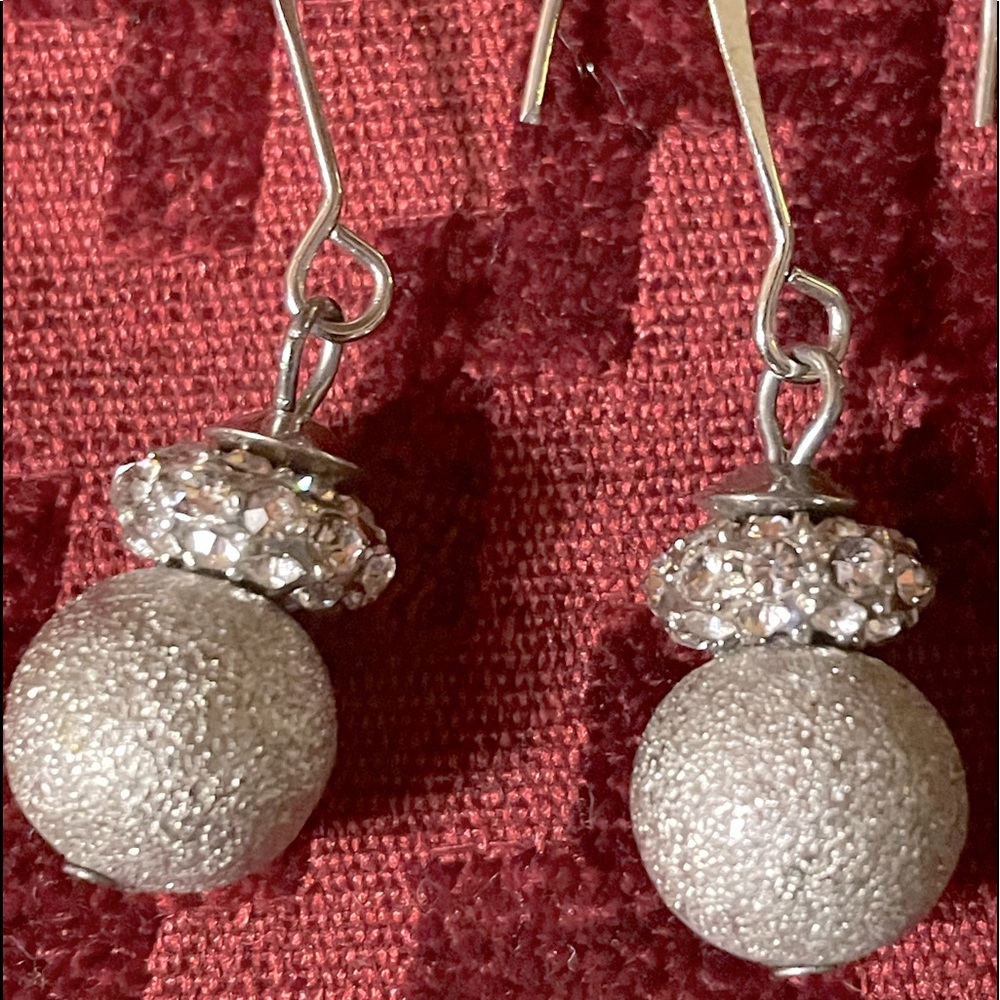 Dangling earrings silver with dimonique treatments. 3”